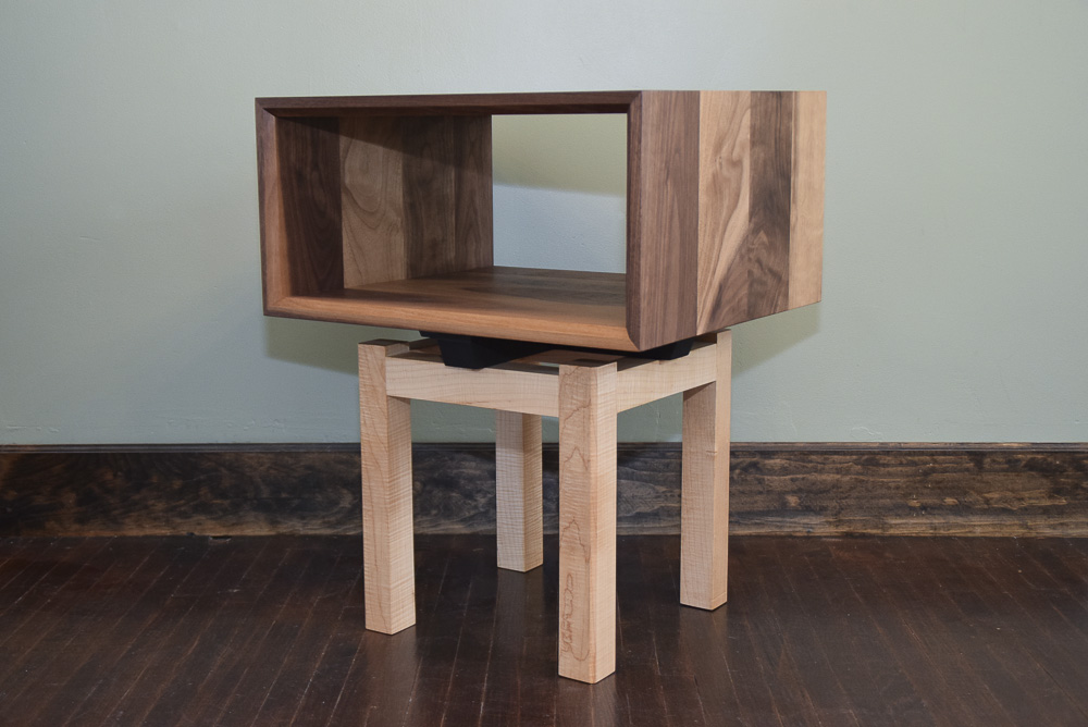 angle view of the walnut and maple open end table